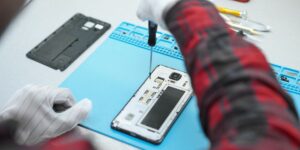 a person repair mobile phone
