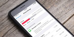 iPhone storage screen displaying used space breakdown and recommendation to store messages in iCloud