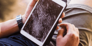 man-holding-a-cracked-screen-tablet
