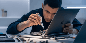 man-repairing-a-laptop