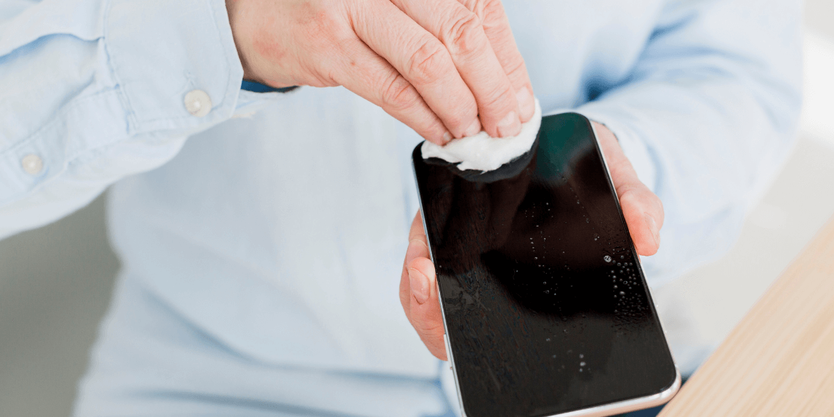 man-cleaning-phone